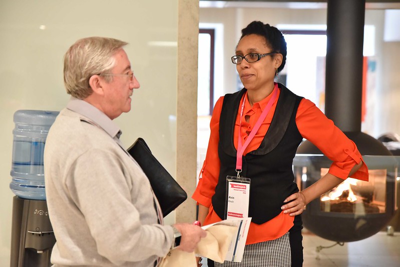 woman speaking to a man with a clipboard