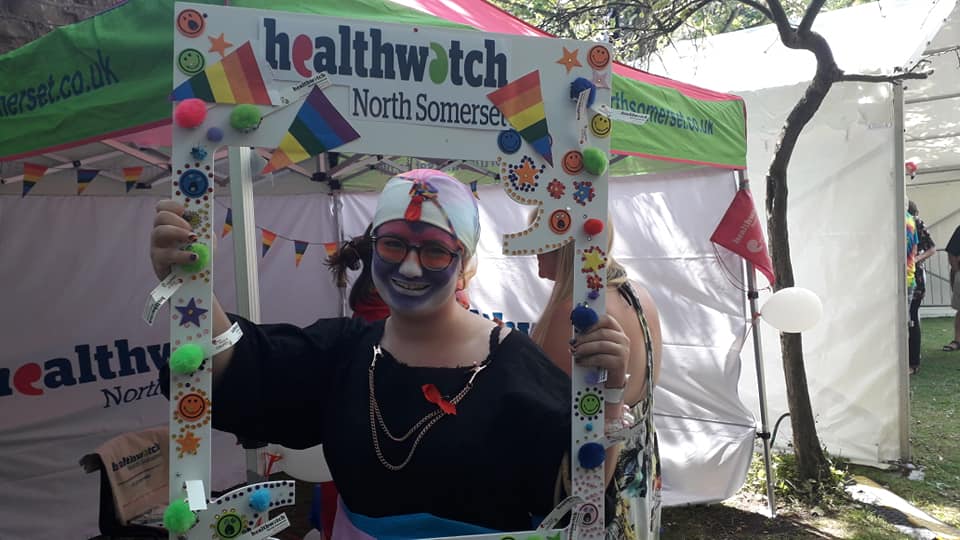 Pride marcher holding selfie frame
