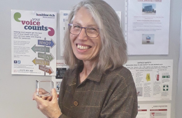 Georgie in our office holding up her award
