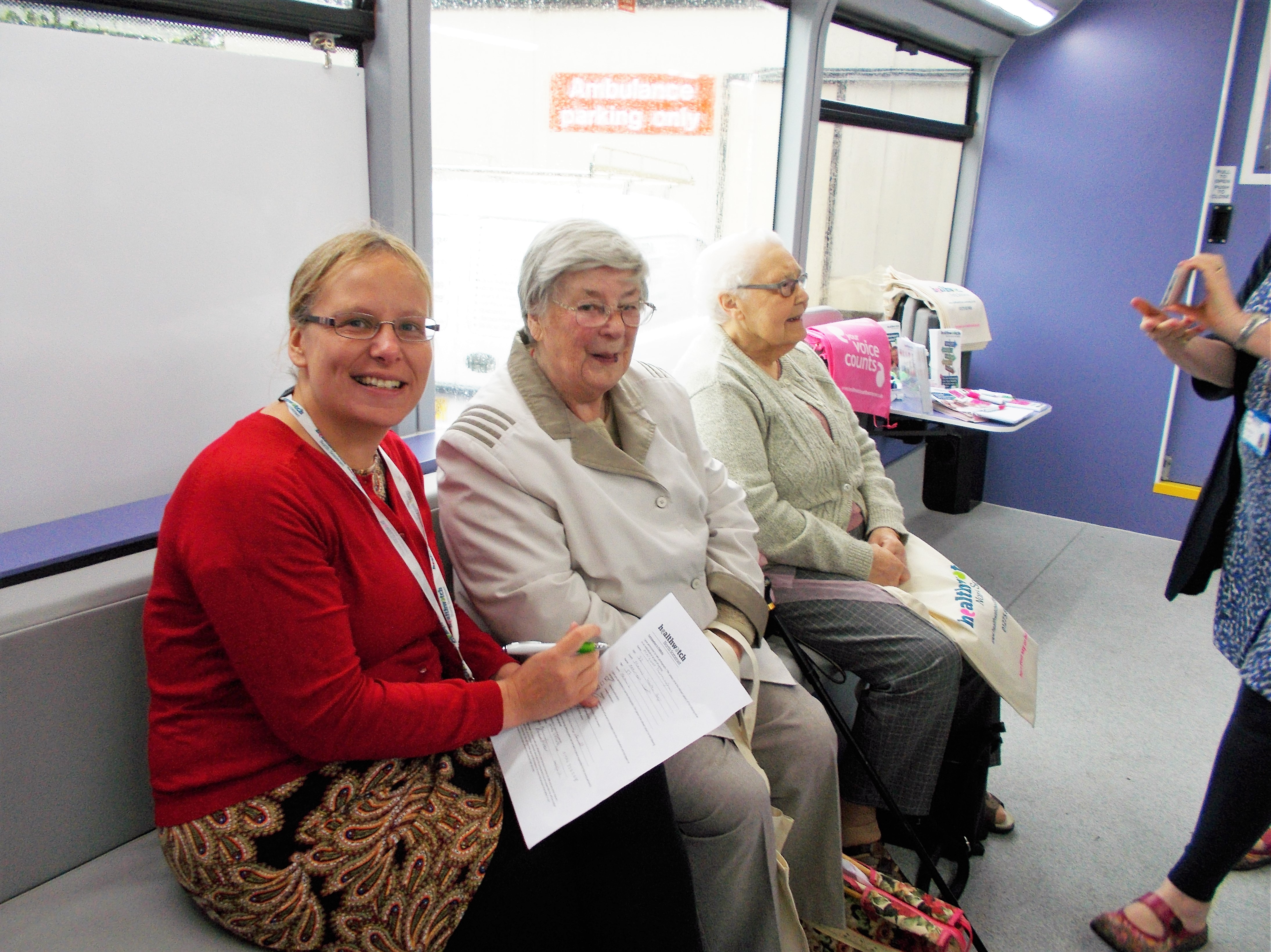 Volunteers sitting on the engagement bus