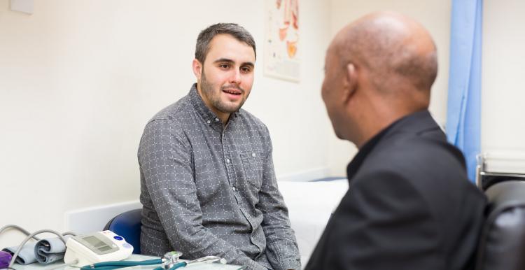 Man talking to his GP in consulting room