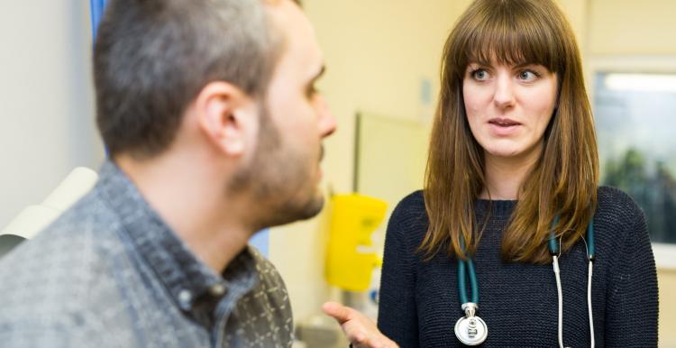 General Practitioner talking to a patient