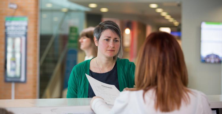 Woman stood at a reception 
