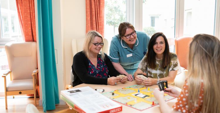 nurse helping residents with activities