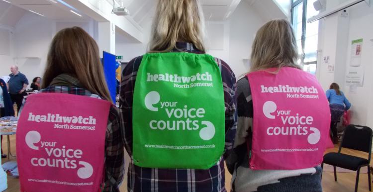 Healthwatch backpacks on three ladies backs