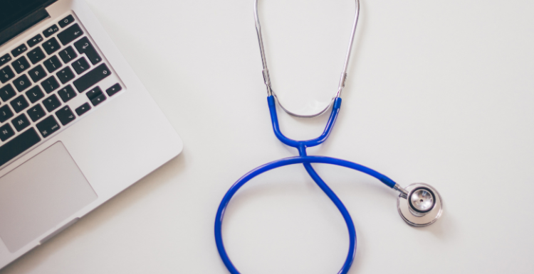 A stethoscope and a laptop