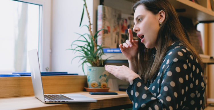 A woman using sign language during a video call
