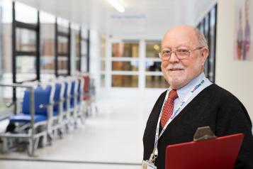 Man standing in a hospital corridor