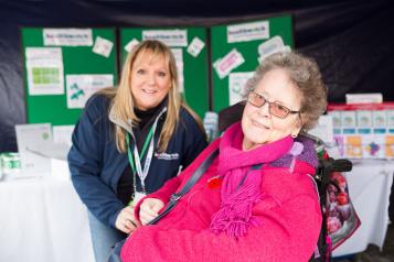 Lady in her wheelchair with a Healthwatch volunteer