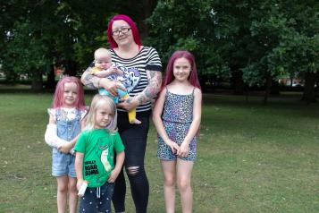 Mum standing with three children and her baby