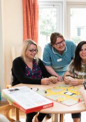 nurse helping resident with their activities